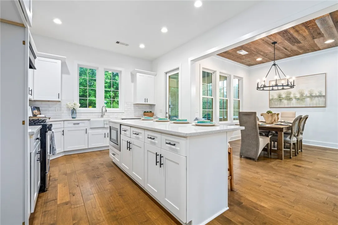 Kitchen overlooks living and dining area making entertaining a breeze.