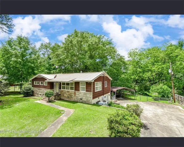 A charming home nestled amongst vibrant greenery offers a comfortable lifestyle.