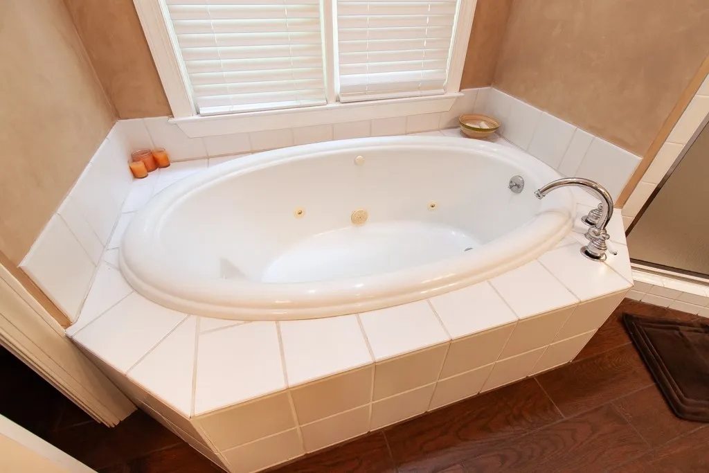 Indulge in a spa tub, complete with tile surround.