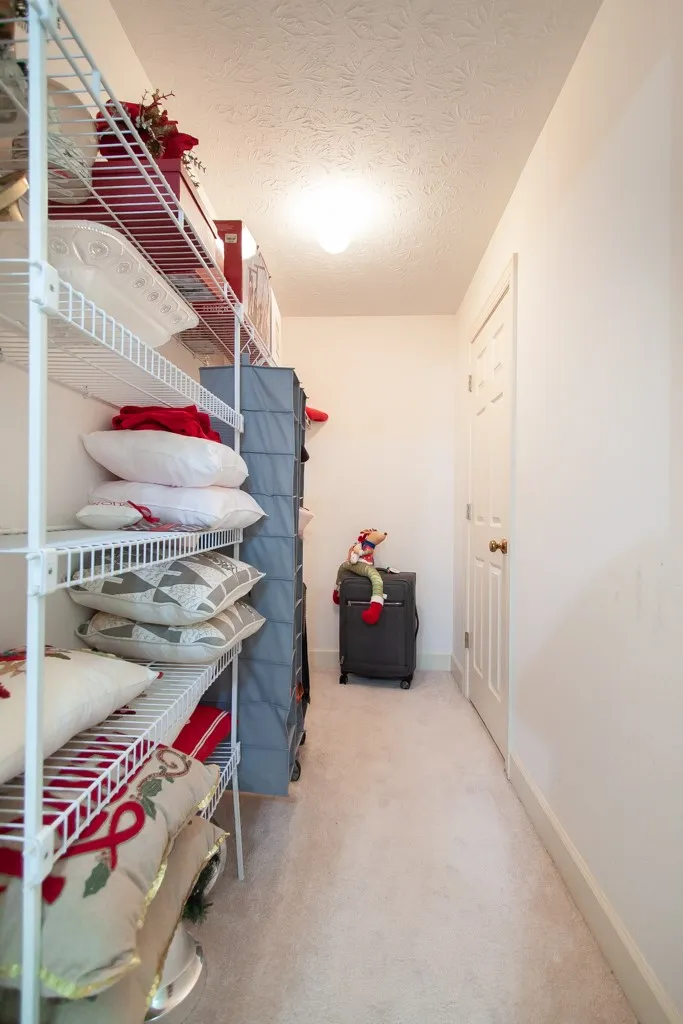 Upstairs Hall closet. Great storage space! Located upstairs at the end of the hallway.  Also has WI attic access.