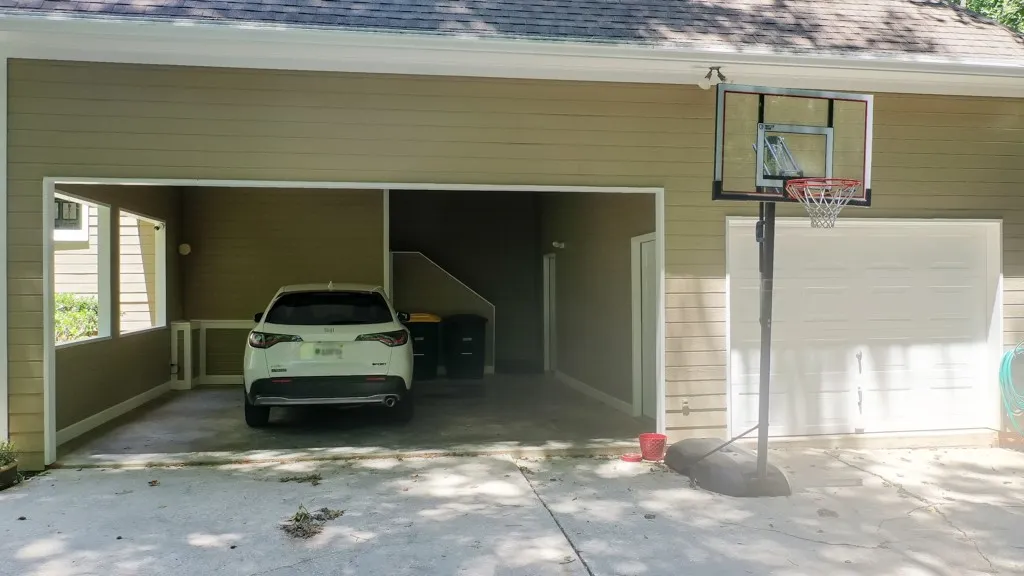 2 car carport and a single bay garage that's a wired workshop.  There is also a half bath accessible from the carport and the back yard.