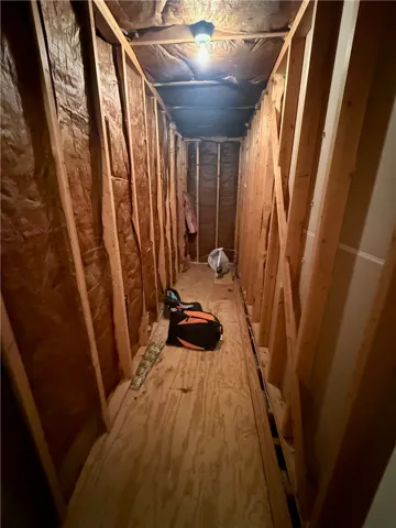 Opens from the walk-in storage closet. Ample attic storage space offers practical solutions for organizational needs.