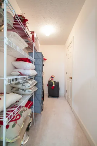 Upstairs Hall closet. Great storage space! Located upstairs at the end of the hallway.  Also has WI attic access.