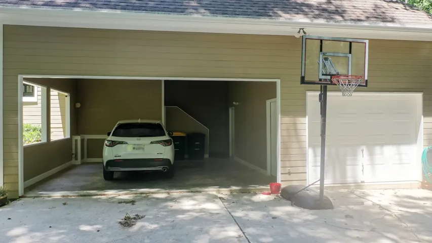 2 car carport and a single bay garage that's a wired workshop.  There is also a half bath accessible from the carport and the back yard.