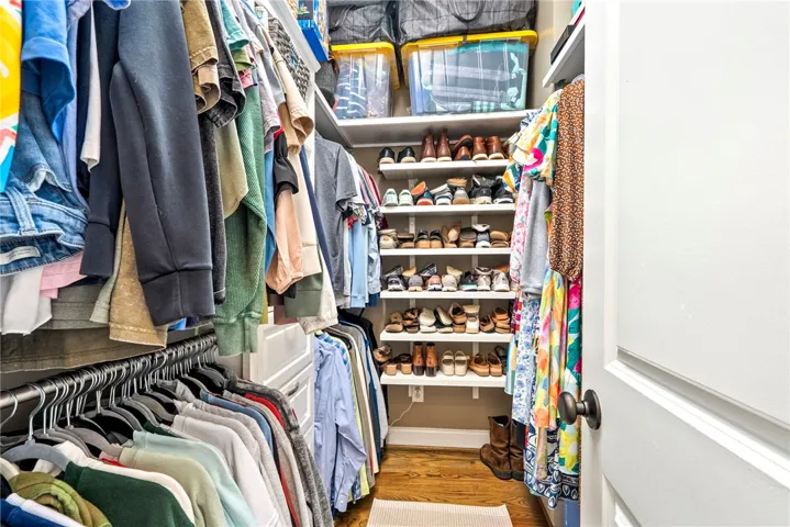 Custom shelving and ample hanging space create an organized haven for any wardrobe.