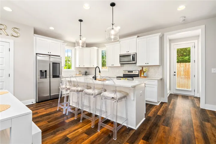 Kitchen features a large center island providing additional storage and seating.