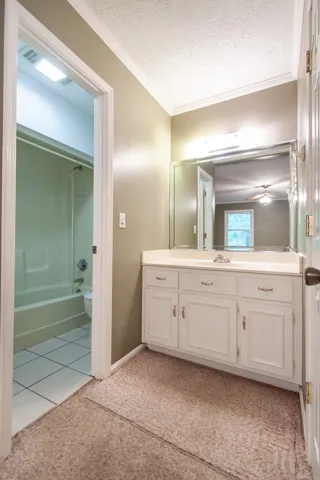 Primary bath with separate vanity & dressing area.