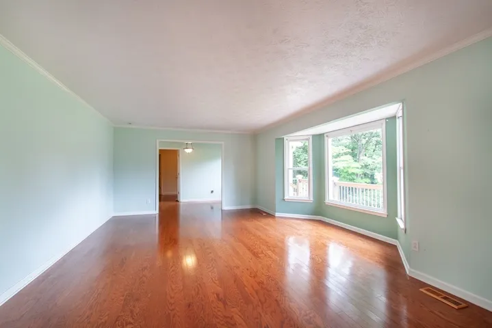Rich hardwood floors adorn the living/dining room combination.