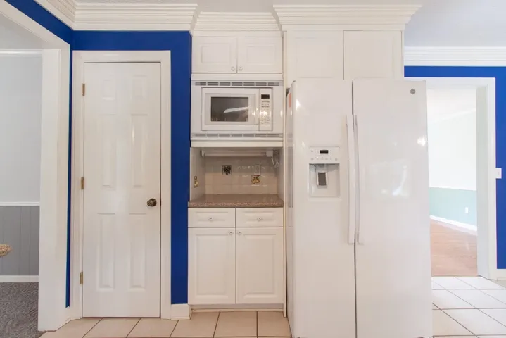 Built-in microwave & new refrigerator remain.