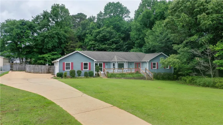 Corner lot with large front yard, perfect for lawn games or active pets.