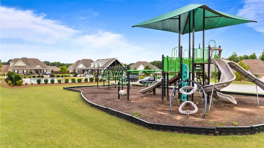 A vibrant playground and sparkling community pool await in this family-friendly neighborhood.