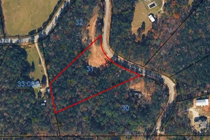 A spacious, wooded parcel offering a prime location for a custom-built residence.