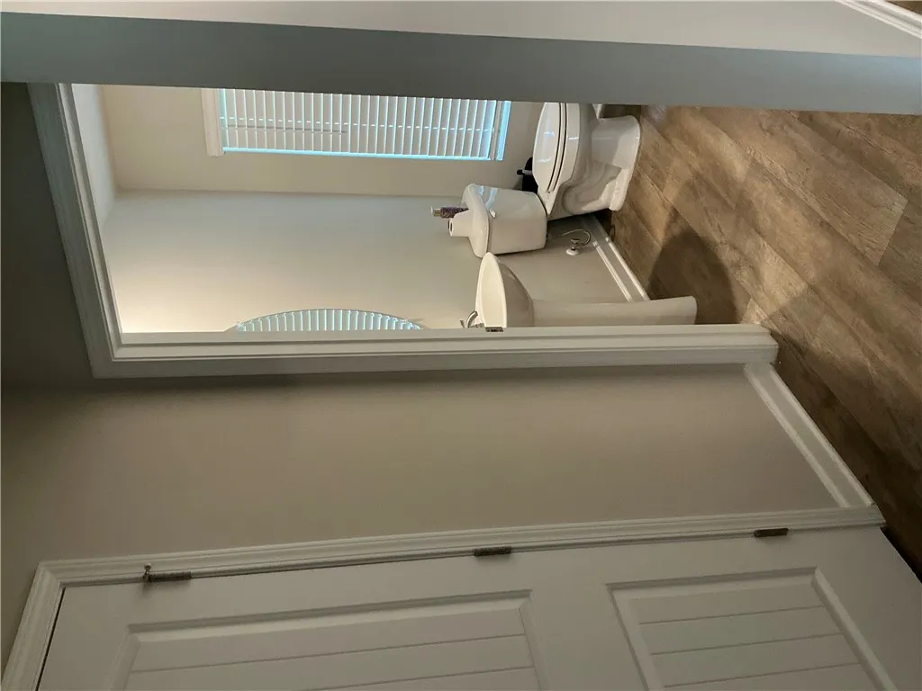 Functional, clean lavatory with durable flooring provides practicality and convenience.