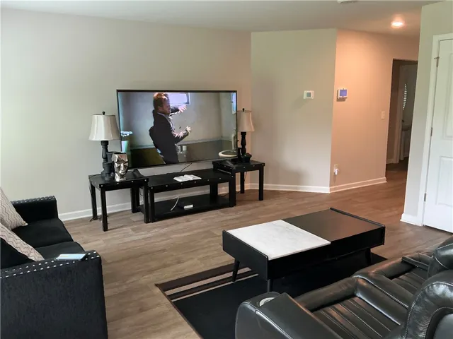 Well-lit living room offers ample space for gathering and relaxing.