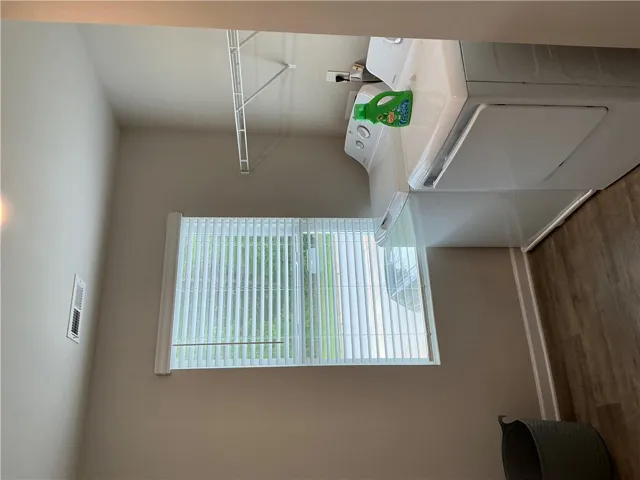 Functional laundry room offers convenient appliances and natural light.