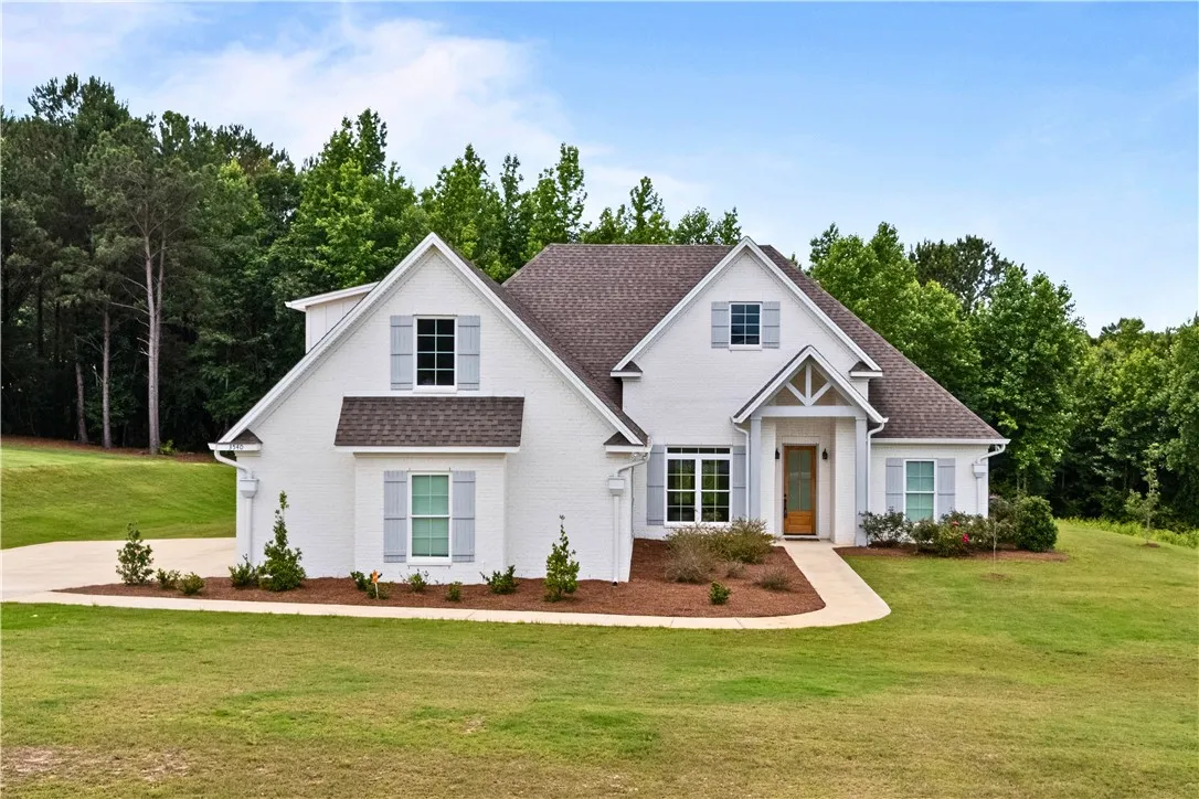 A classic brick exterior, complete with a charming front door, creates a welcoming presence.
