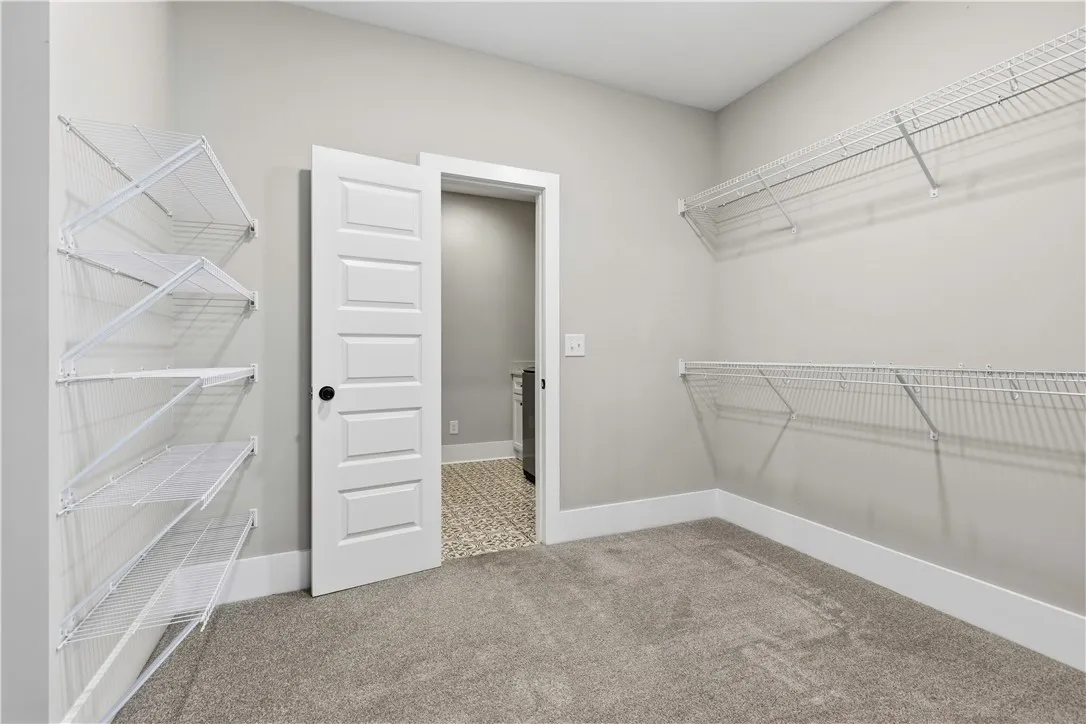 Spacious closet space with ample wire shelving provides convenient storage solutions.