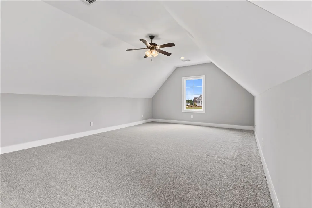 A spacious, naturally illuminated loft area offers endless possibilities for customization and expansion.