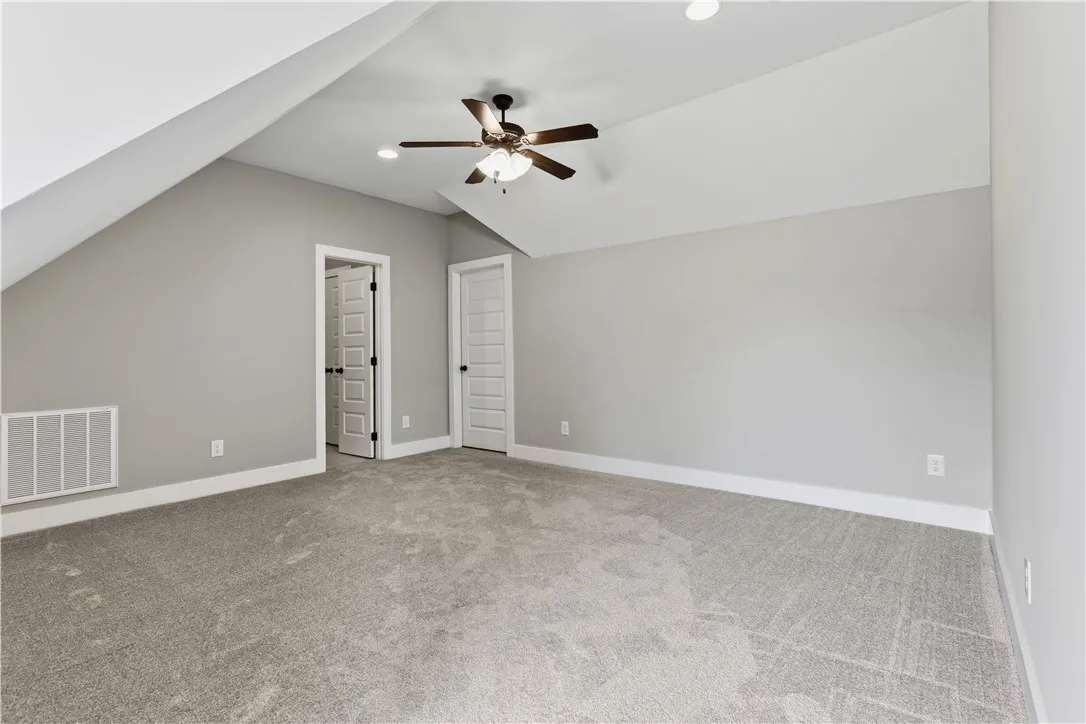 A spacious room upstairs with its very own full bath offers a great place guests or family.