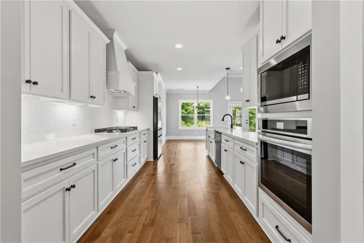 Clean lines and a spacious layout define this modern kitchen with ample counter space and storage. Gas stove and stainless appliances.