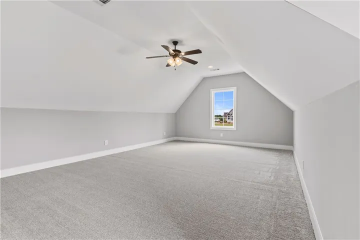 A spacious, naturally illuminated loft area offers endless possibilities for customization and expansion.
