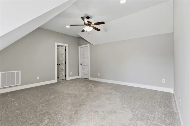 A spacious room upstairs with its very own full bath offers a great place guests or family.