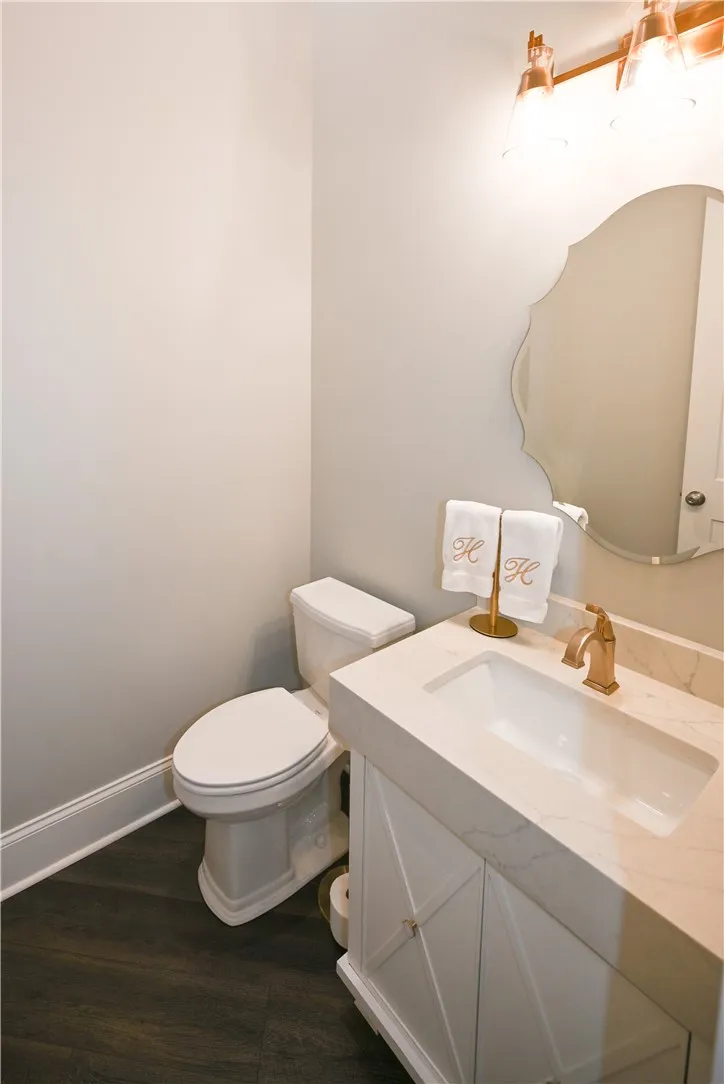 A chic powder room discreetly tucked away for guests' convenience.