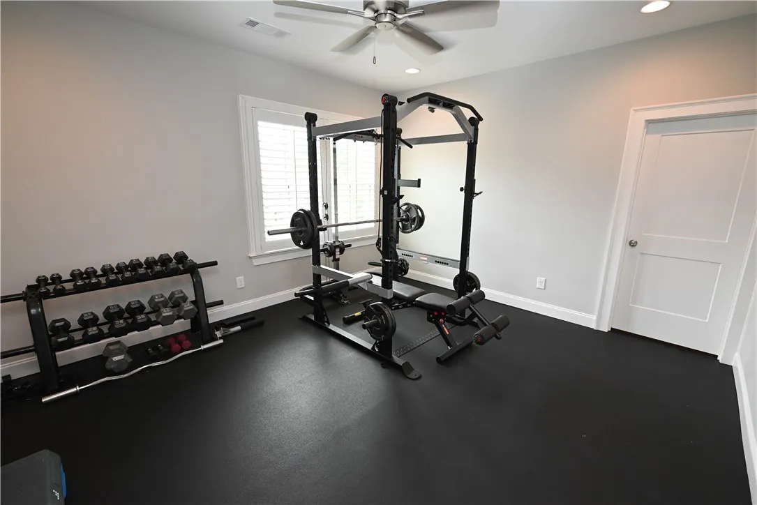 Private flex room off of 5th bedroom, currently used as a workout space.