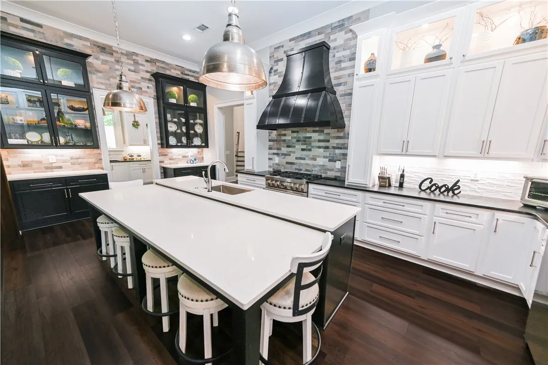 With its bi-level design, the unique kitchen island provides a dedicated dining space without sacrificing any prep or storage space.