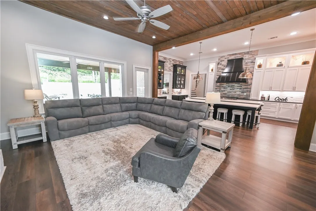 A wall of windows provides this spacious great room with plenty of natural light as well as gorgeous views of the covered patio and backyard!