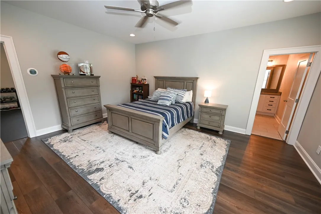 5th bedroom, which has an attached flex room, private bathroom, and tons of closet space.
