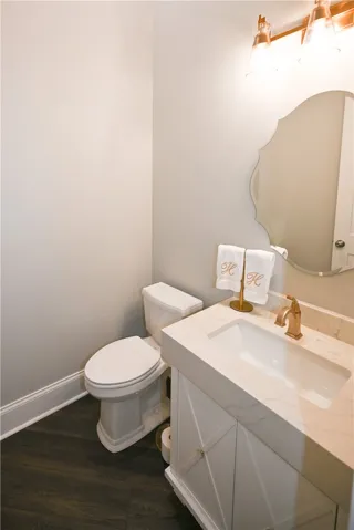 A chic powder room discreetly tucked away for guests' convenience.