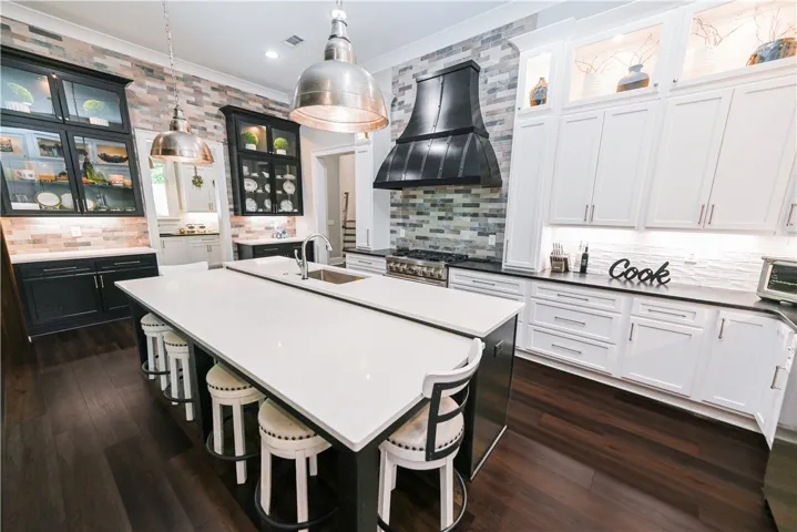 With its bi-level design, the unique kitchen island provides a dedicated dining space without sacrificing any prep or storage space.