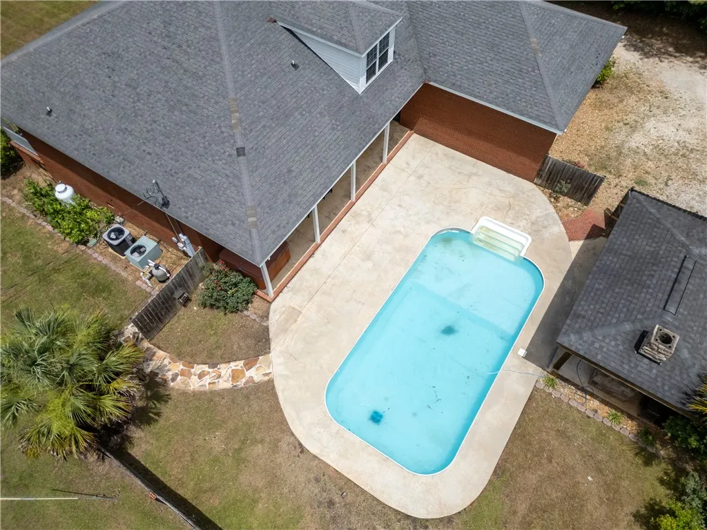 An aerial perspective reveals a private outdoor pool and expansive patio, perfect for leisurely afternoons.