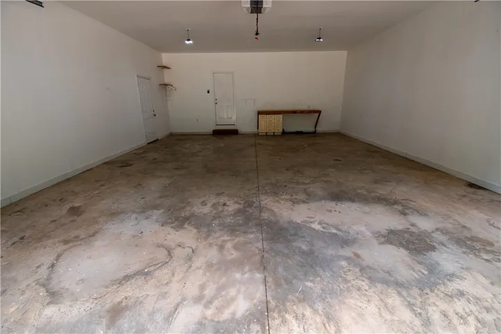 A spacious, adaptable two-car garage providing ample storage and workspace potential.
