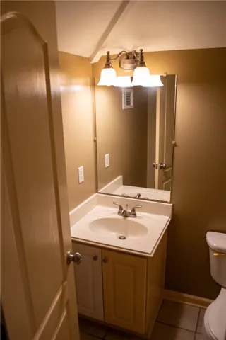 A compact and functional bathroom vanity, offering practical storage and essential fixtures.
