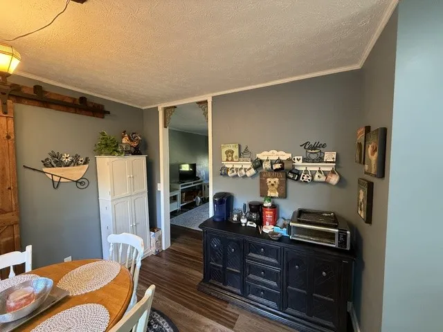 Hardwood floors and a spacious layout enhance this comfortable eat-in kitchen.
