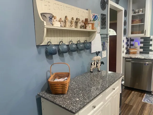 A well-appointed kitchen showcasing durable countertops and modern appliances.