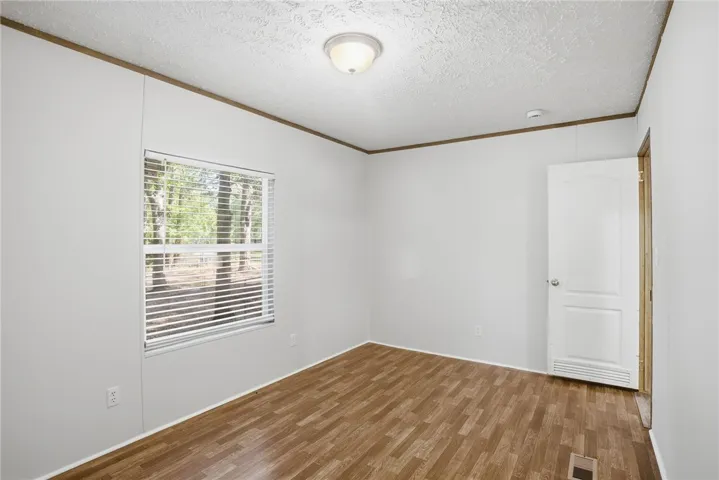 A quiet retreat with durable flooring and natural light, ready for personalization.