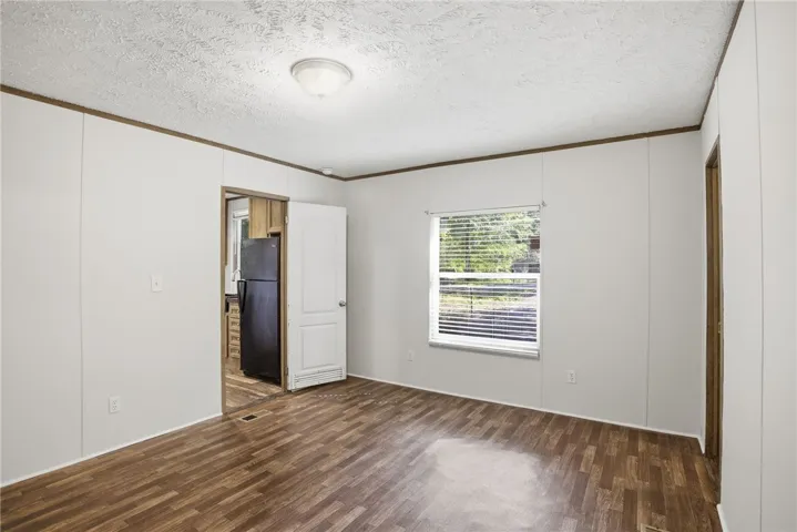 A versatile open space with wood-look flooring and ample natural illumination.