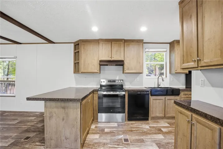 A well-appointed kitchen features ample counter space and modern appliances for culinary pursuits.