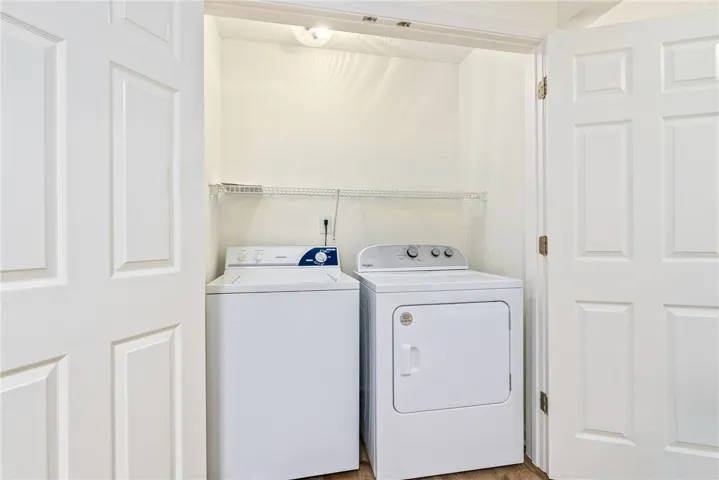 A dedicated laundry space provides practical, in-home convenience with a washer and dryer.