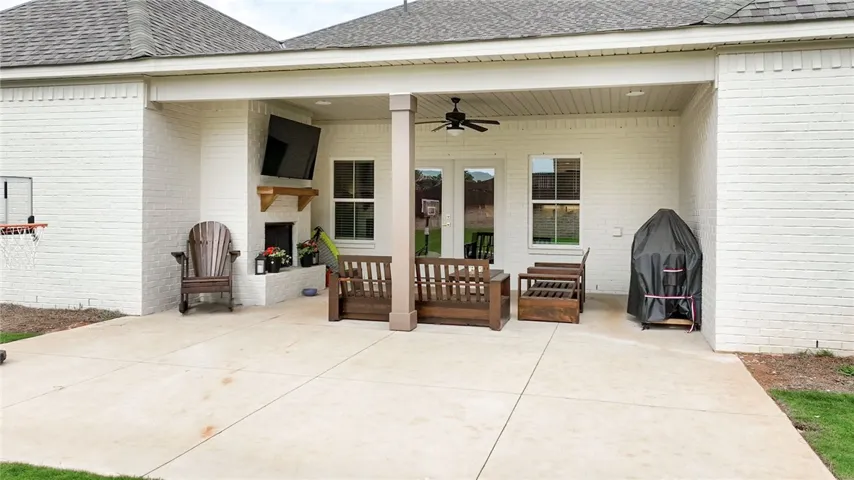 A spacious covered patio invites relaxation and entertainment.
