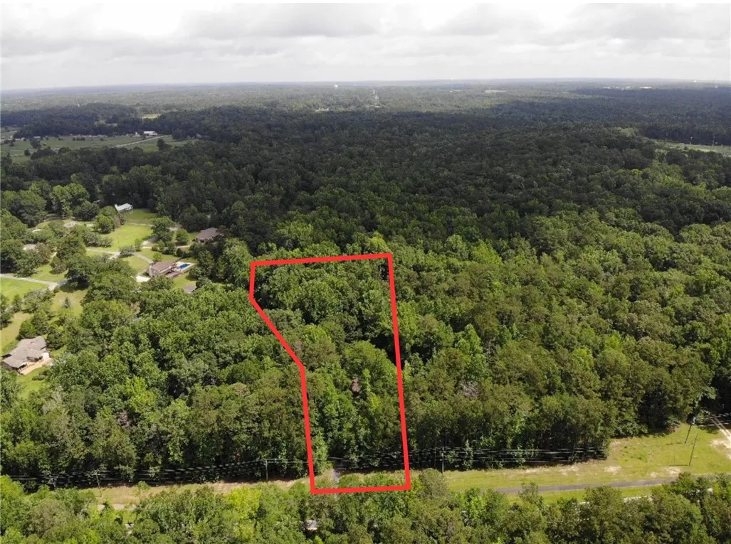A tranquil, tree-lined lot provides a serene setting for your future home.