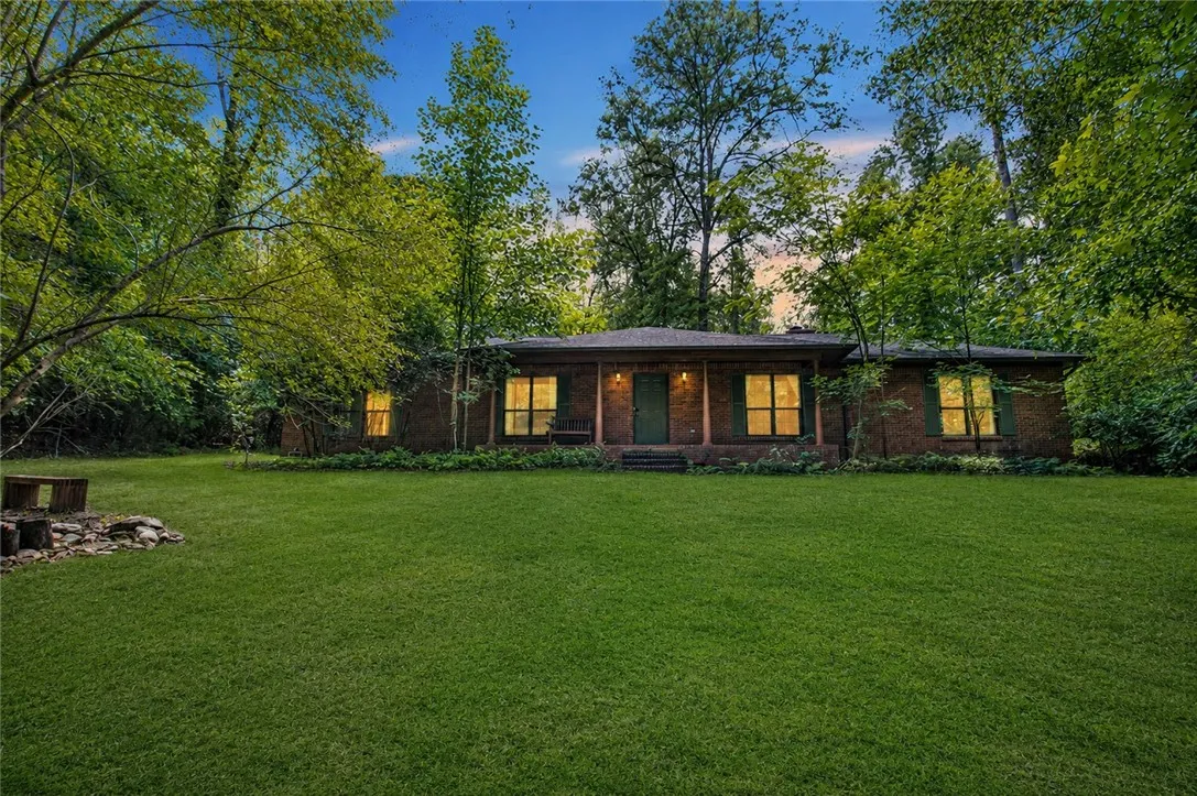 Beautiful views from this porch include a wood bottom and a flowing koi pond