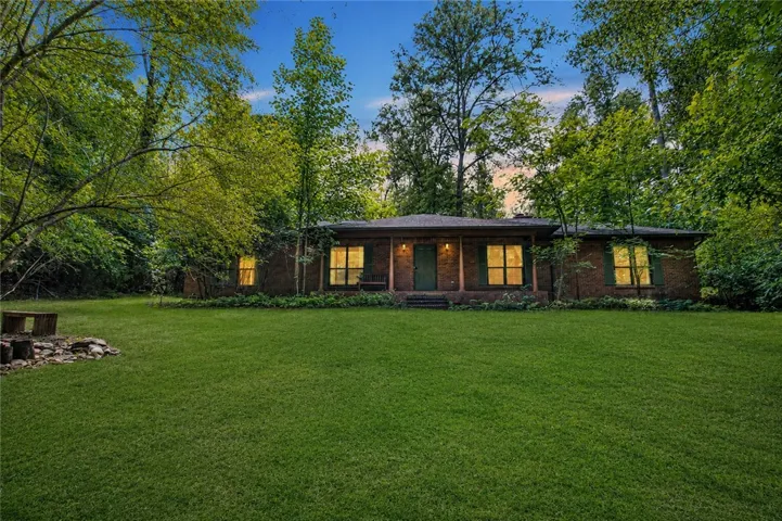 Beautiful views from this porch include a wood bottom and a flowing koi pond