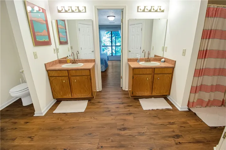 Dual vanities provide ample space in this well-appointed bathroom.