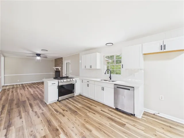 A well-appointed kitchen boasts sleek countertops and modern stainless steel appliances.