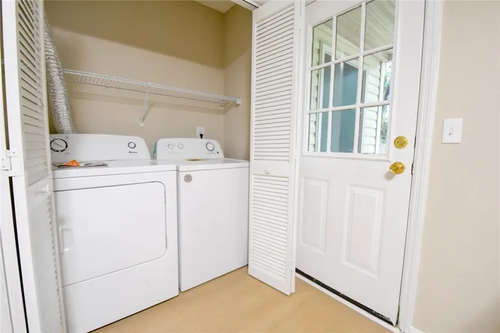 Conveniently located laundry area with ample storage and a direct exterior access door.
