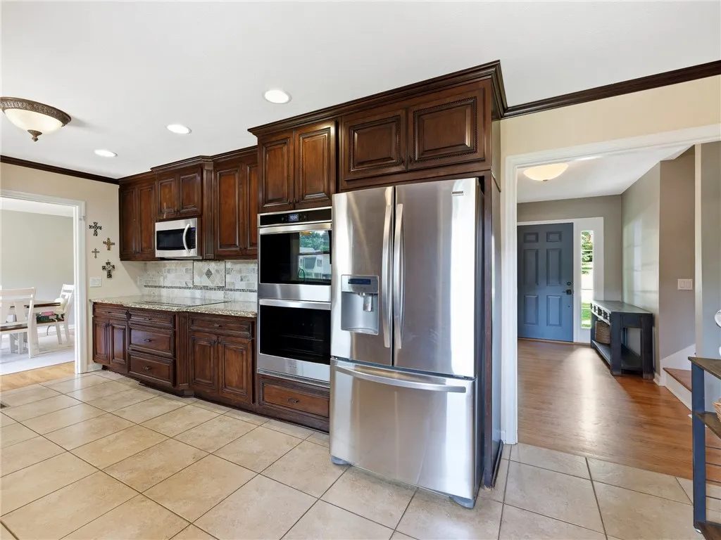 A chef's delight, this kitchen showcases sleek stainless steel appliances and abundant cabinetry.